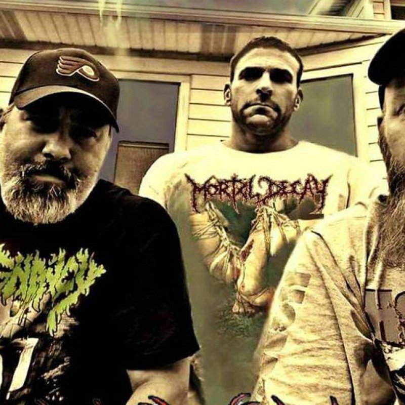 Comatose Music celebrate 20 years of Mortal Decay's classic A Gathering Of Human Artifacts with an anniversary reissue with new, brutal artwork.