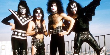 KISS WORKING ON BOOK OF POSTERS